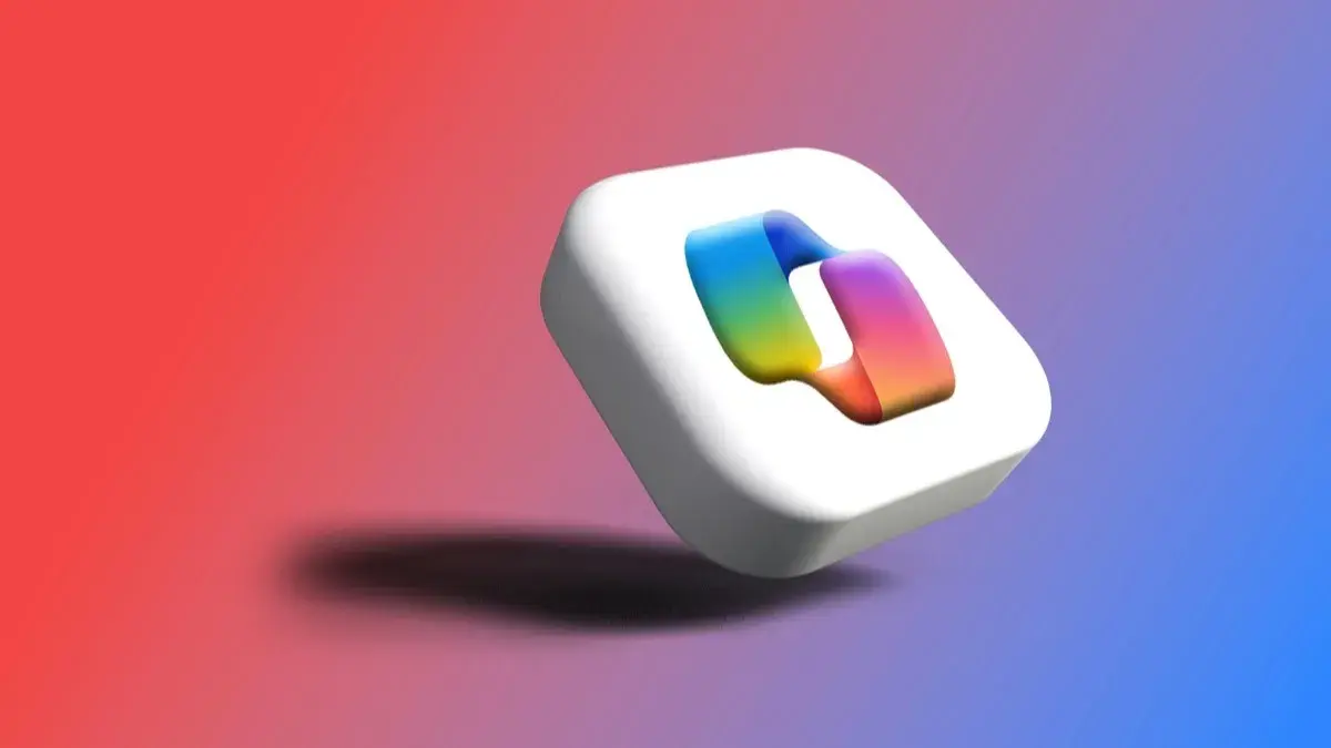 A 3D Microsoft Copilot logo tile against a red and blue gradient background